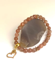 Pink sunstone with gold moon, gold heart, silver lotus